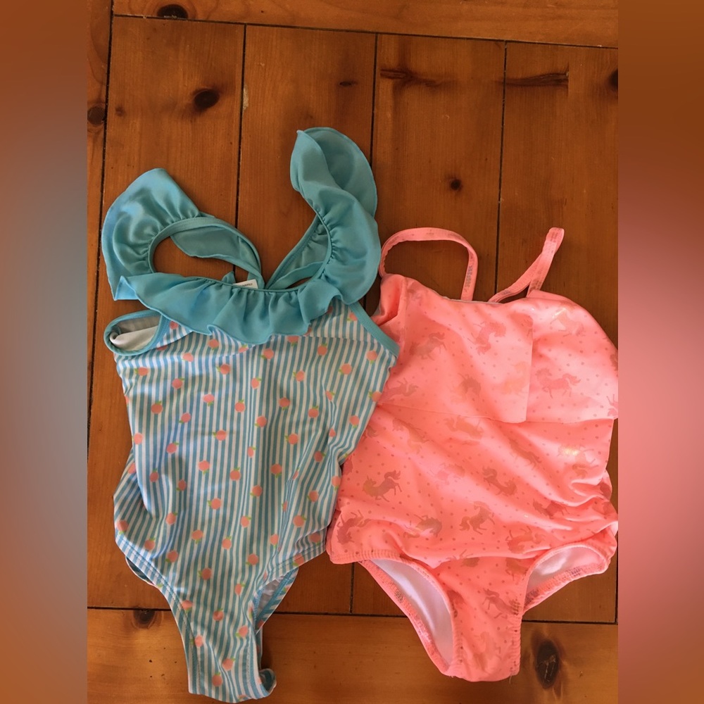Two swimsuits one by Penelope Mack and other Mia and Miles